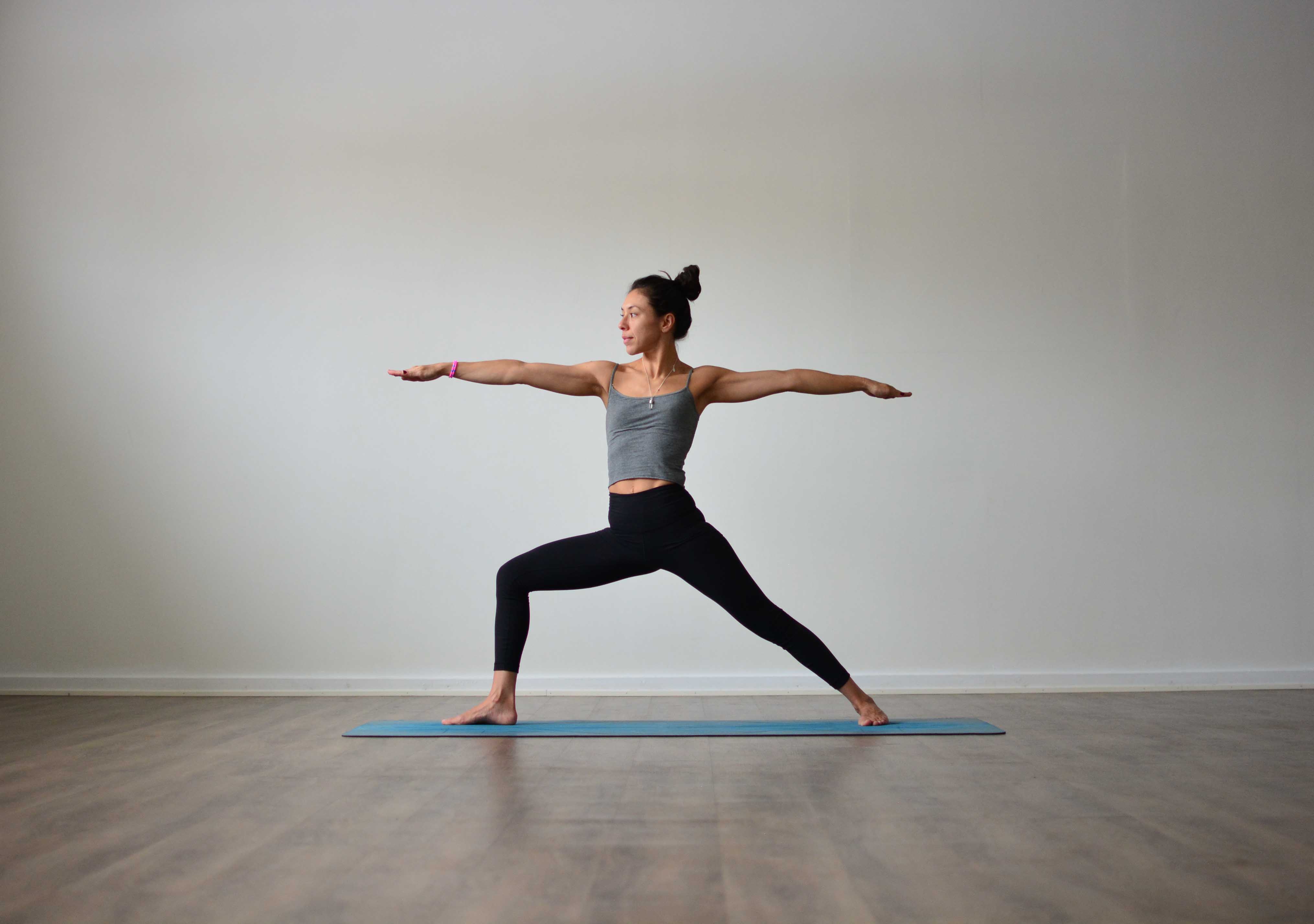 Mula bandha in Warrior II pose