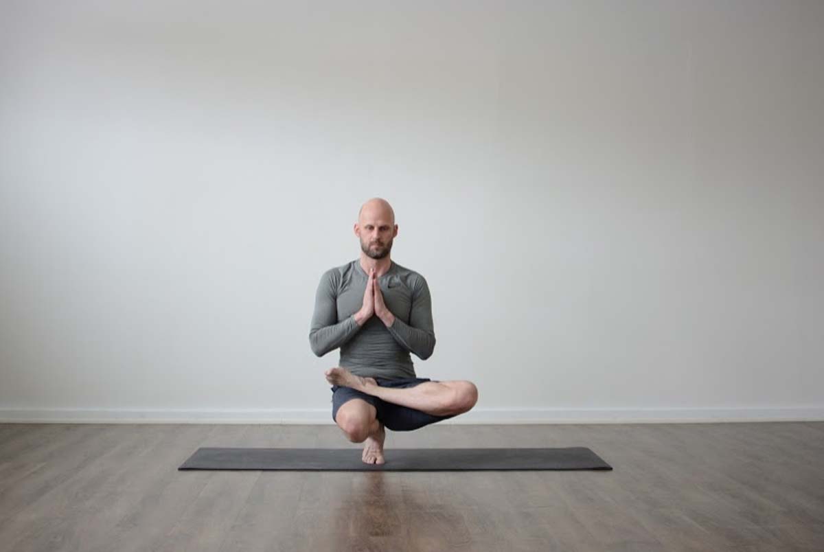 Toe stand pose - Padangustasana Bikram Yoga - YOGATEKET